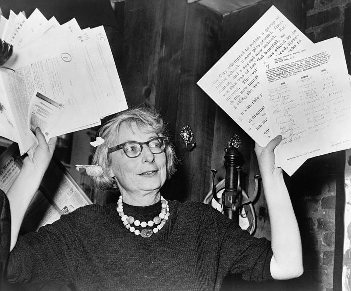 Jane Jacobs holding papers