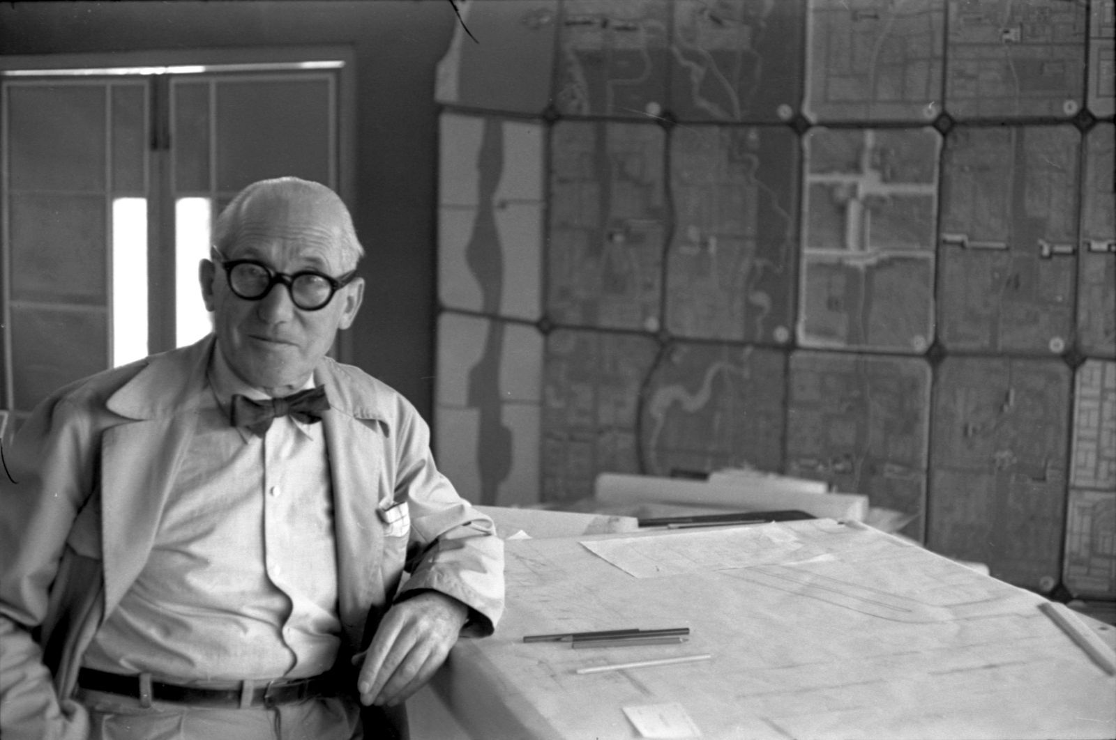 Le Corbuisier at his desk
