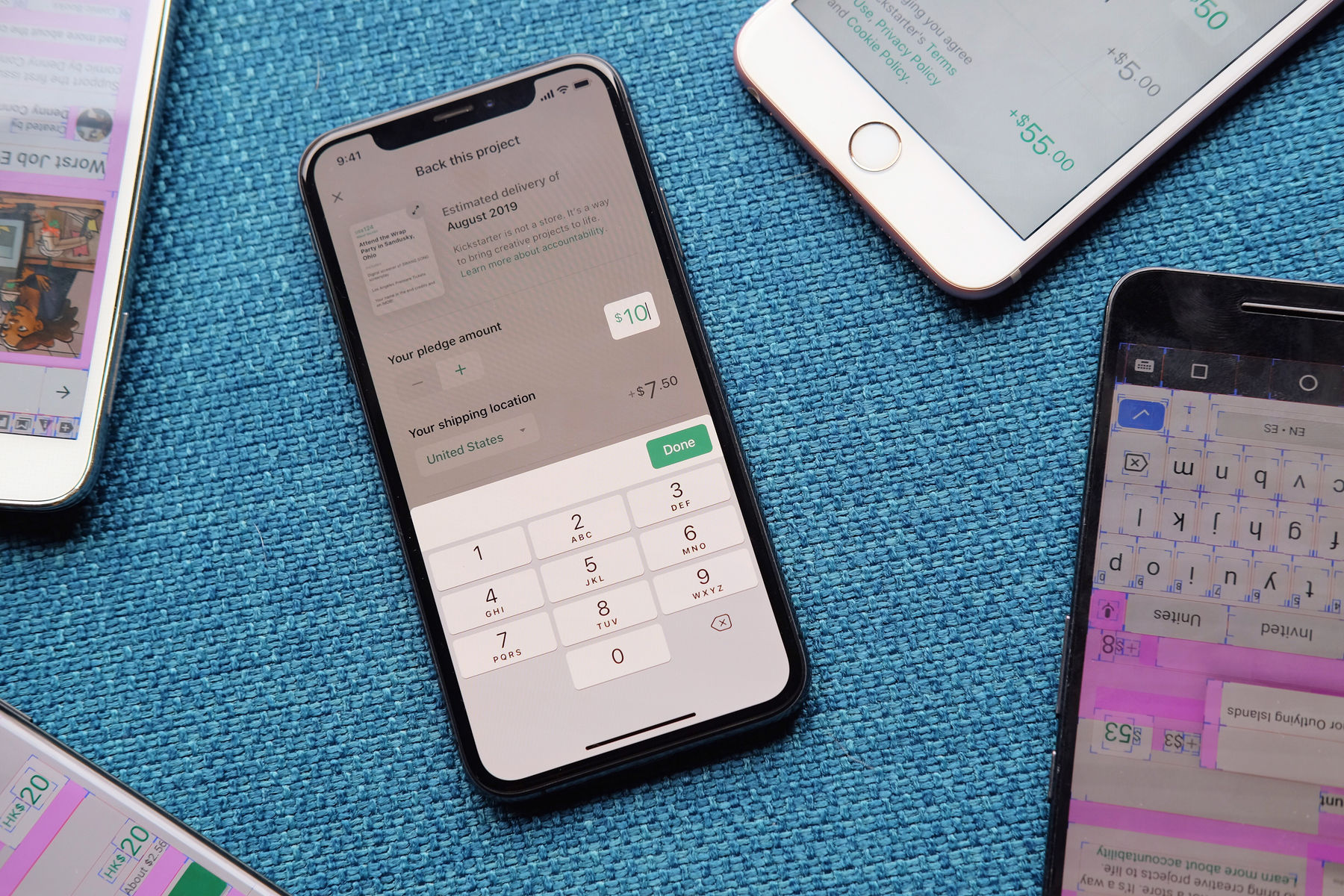 Photo of several phones with various parts of the Kickstarter checkout process displayed on their screens