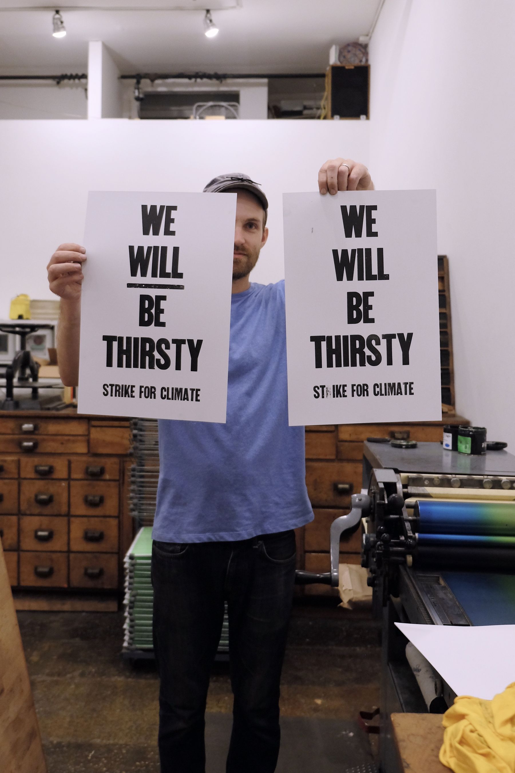 Dan holding up two test prints