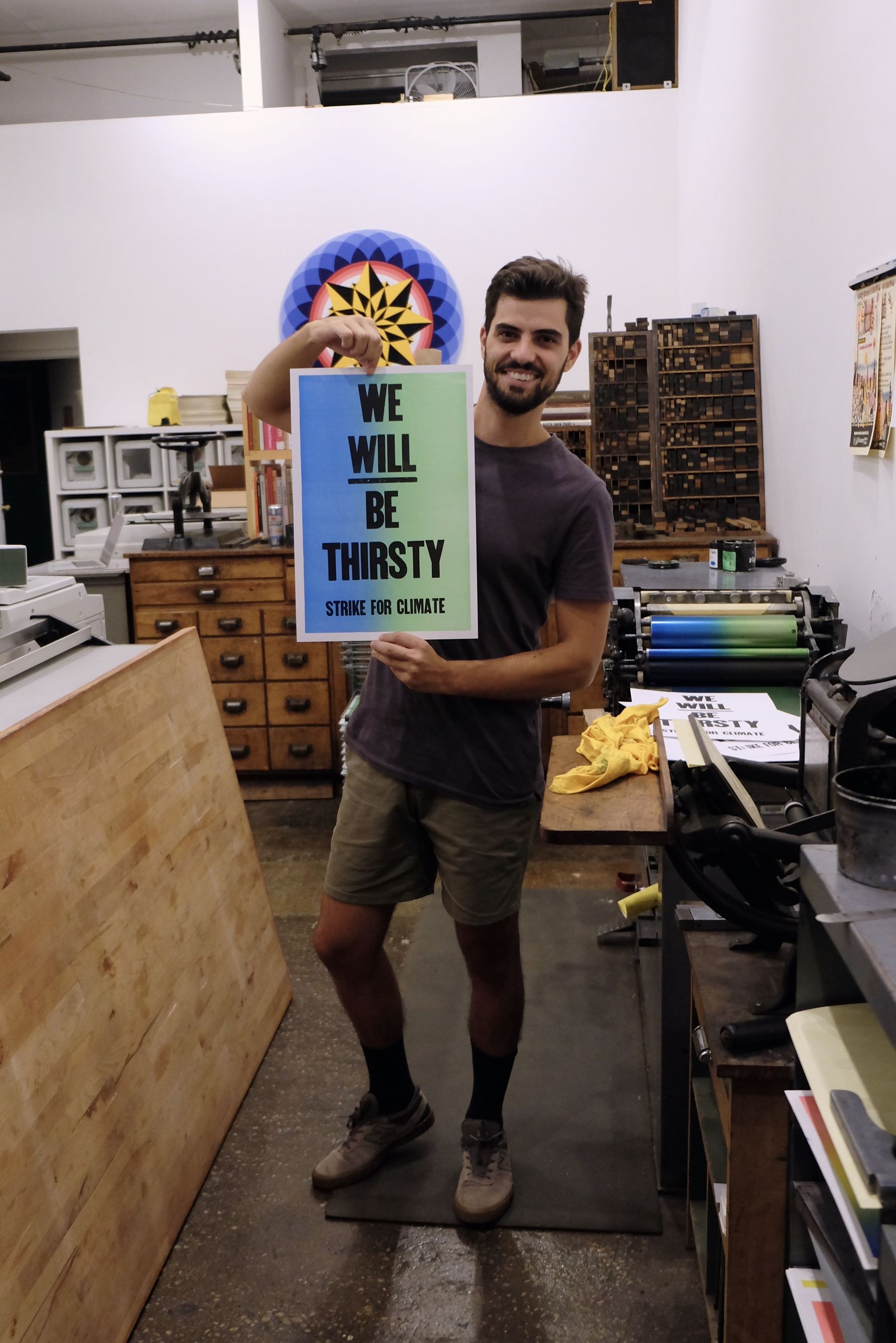 Danny proudly holding up a completed print