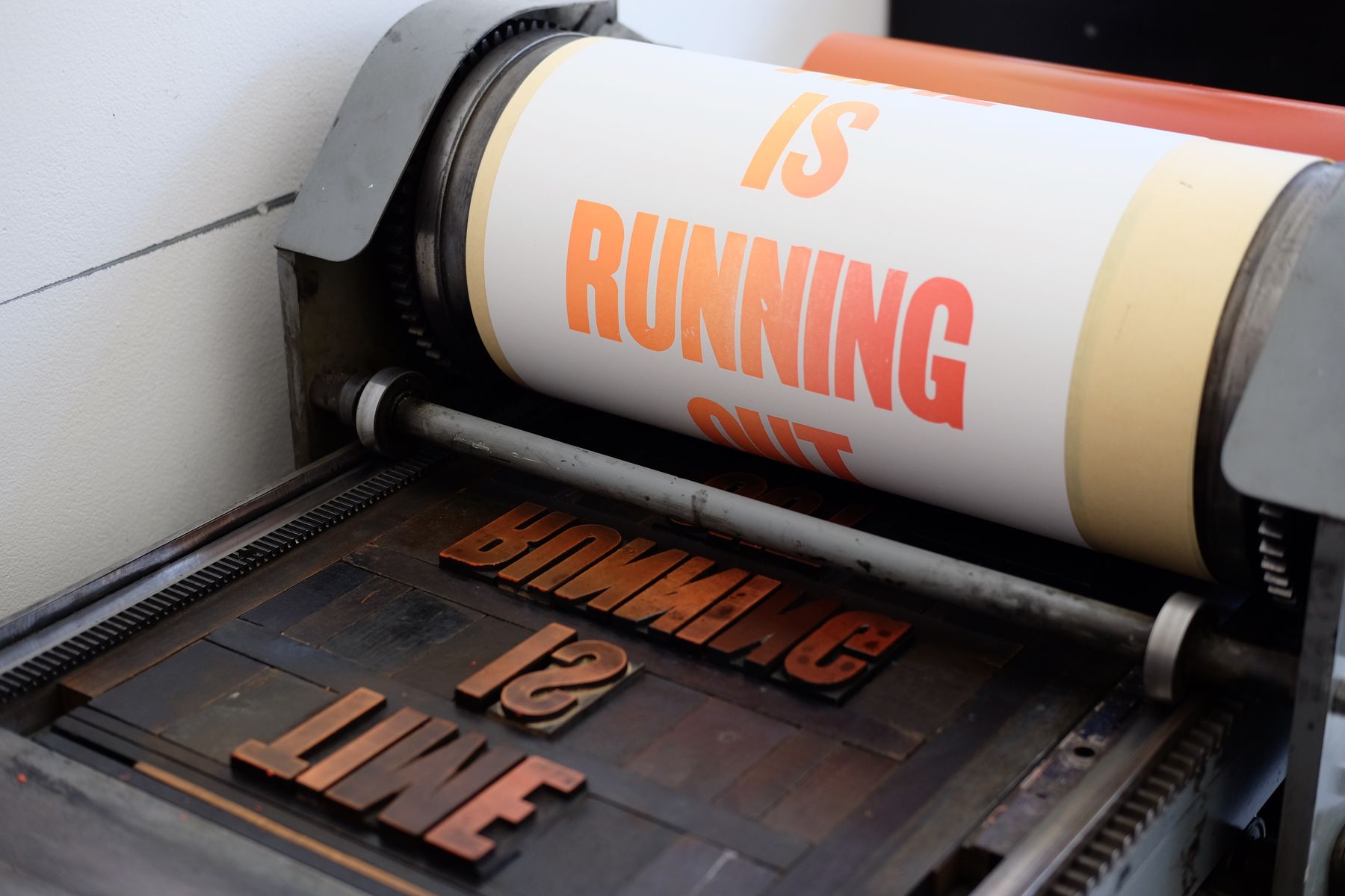 A printed poster coming out of the letterpress