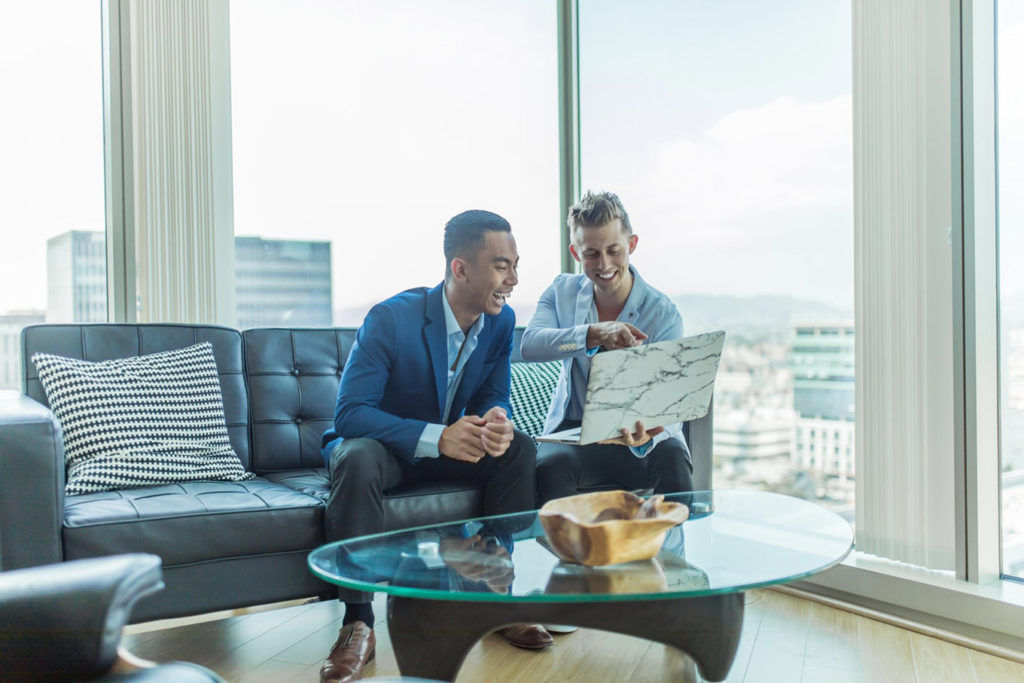 Tip: Talk to your customers Two men sat talking on the sofa