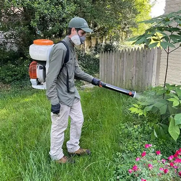 Professional pest control technician from Alexander Pest Control Inc.