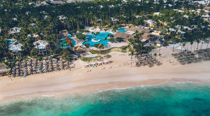 Aerial view of the Iberostar Selection Bávaro Suites resort, pools, and turquoise beach.