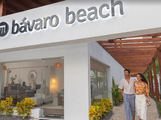 "Guests enjoying their vacation at the main entrance of the Bávaro Beach Hotel in Punta Cana."