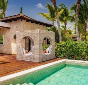 "Luxurious private pool and designer Balinese bed at an exclusive Cap Cana resort"