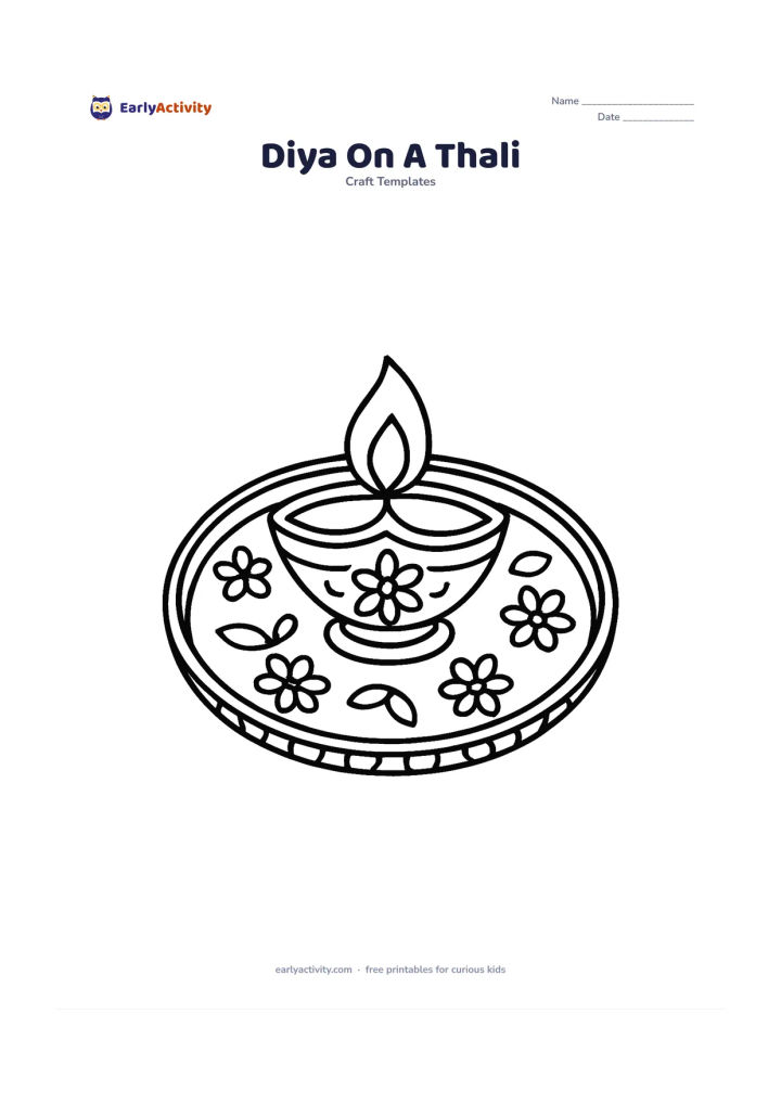 Worksheet: A decorated diya sits in the center of a round Indian thali with flower petals, small leaf shapes, and a patterned rim around the plate.