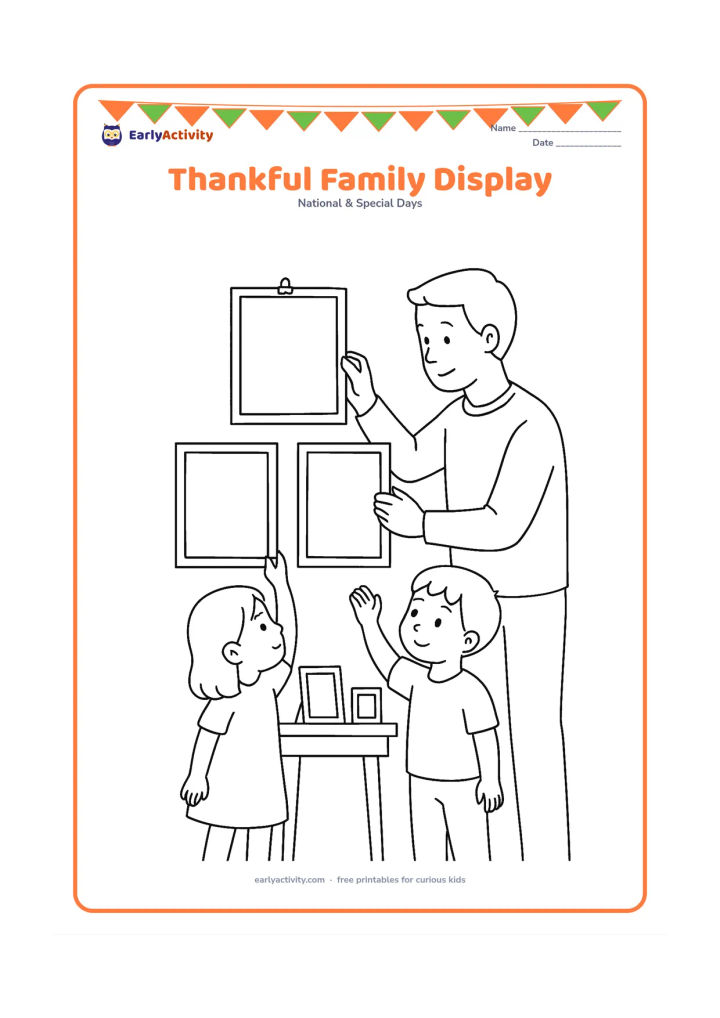 Colouring page: Two children and a caring father figure arrange three blank decorated pages on a home wall, with clips, a small table and family photographs shown only as blank frames.