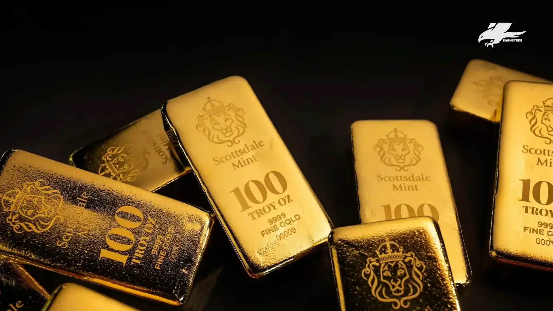 Several gold bars arranged on a dark background