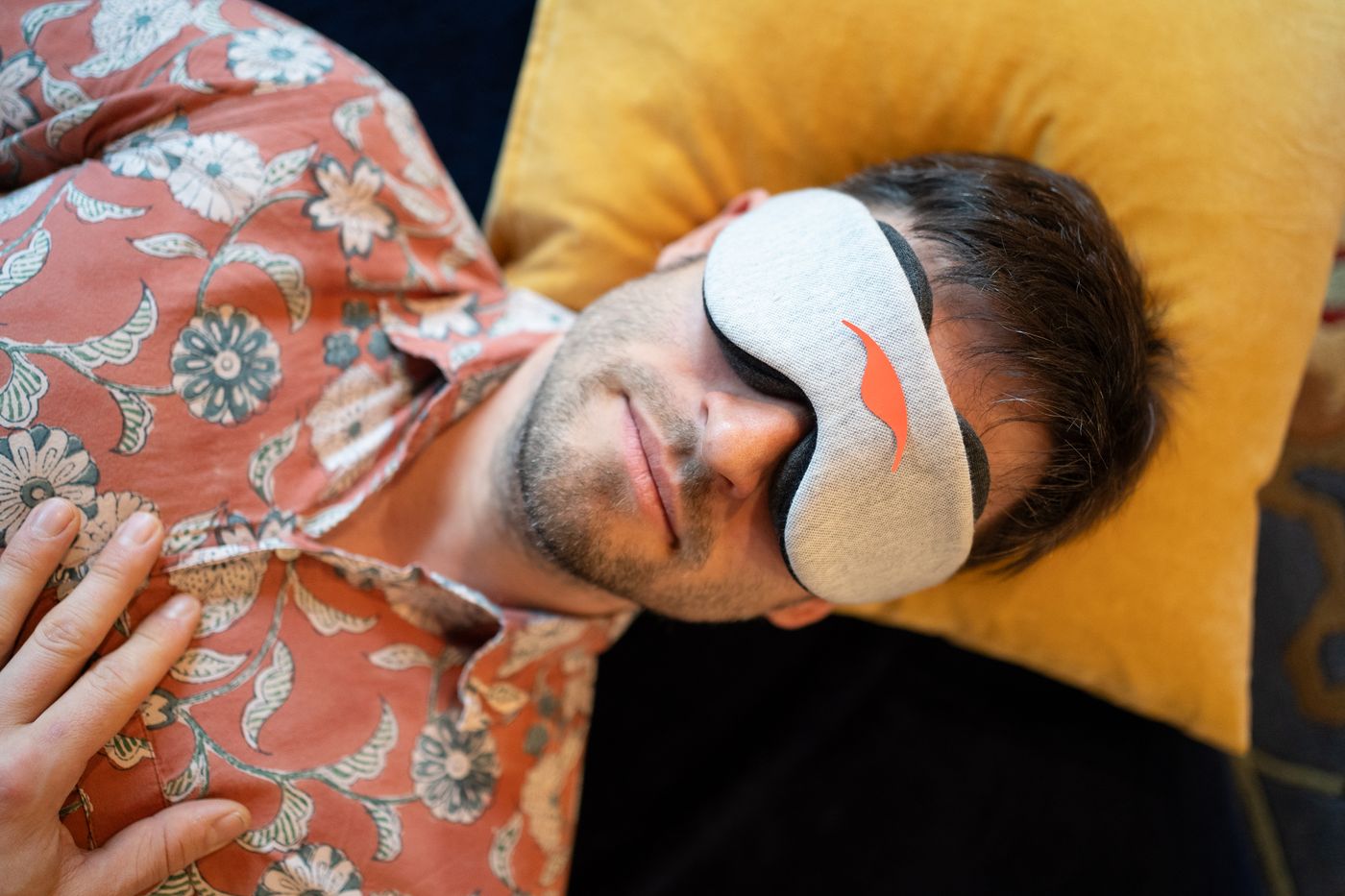 Journeyer lying down with eyemask on
