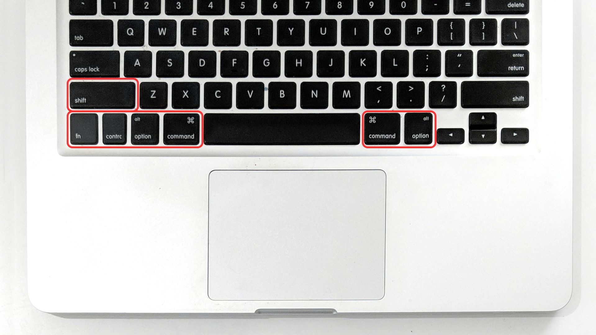A laptop with a keyboard and mouse, highlighting the Mac keyboard modifier keys and their usage.