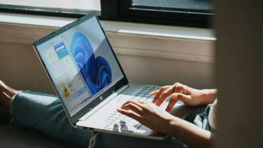 User working on laptop running windows 11 on it. 
