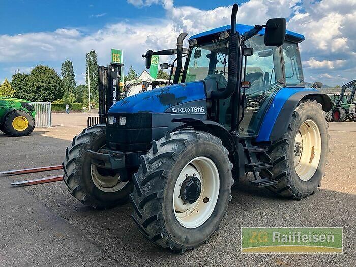 E-FARM: New Holland TS115 - Tractor - id ZSS21FA - Year of construction: 2003 - Engine hours: 9,500,Engine power (HP): 117,Germany