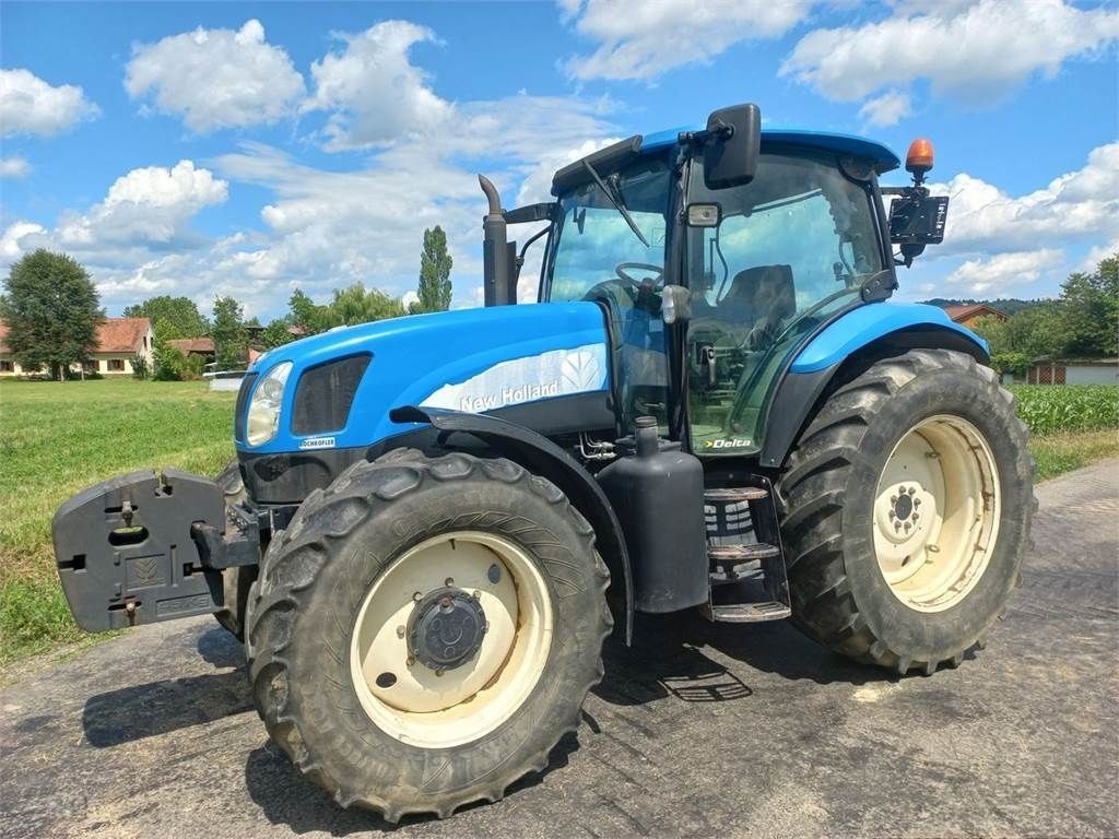 E-FARM: New Holland TS115A Delta - Tracteur - id ABMBIYA - 30 973 € - Année: 2006 - Lecture du nombre d'heure: 10 000,Puissance du moteur (chevaux): 116,Autriche