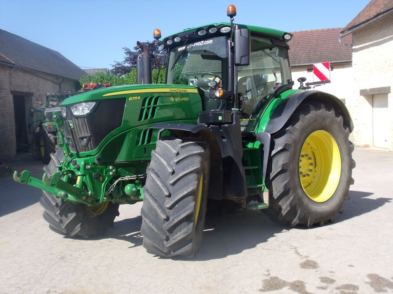 John Deere 6215 R Tractor €125,000