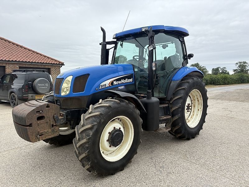 E-FARM: New Holland TS115A - Tractor - id MXRWGFD - 24.950 € - Año: 2004 - Reino Unido