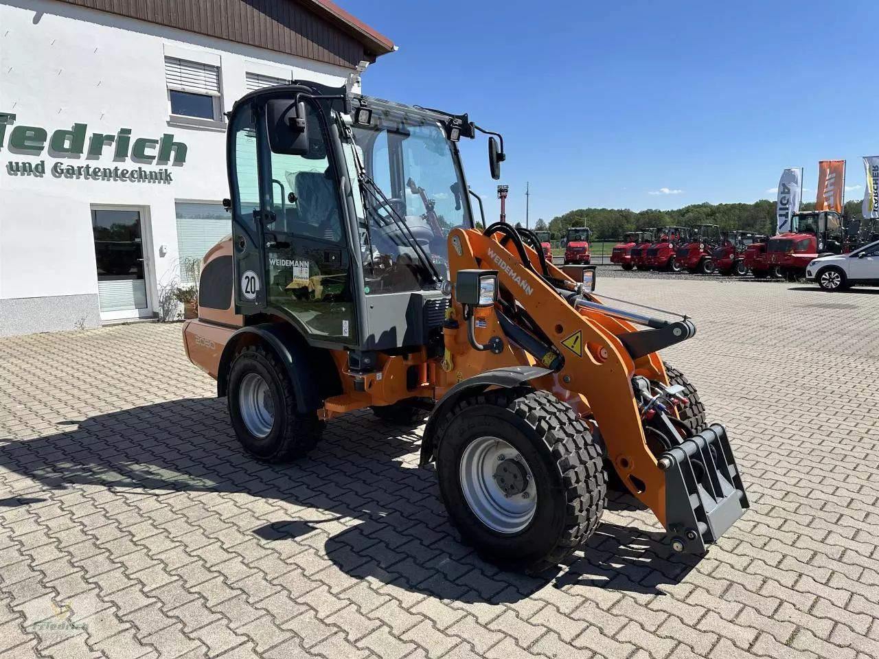 E-FARM: Weidemann 2080 (orange) - Radlader - id QMMIMJ4 - 45.900 € - Baujahr: 2023 - Abgelesene Motorstunden: 150,Motorleistung (PS): 61,Deutschland
