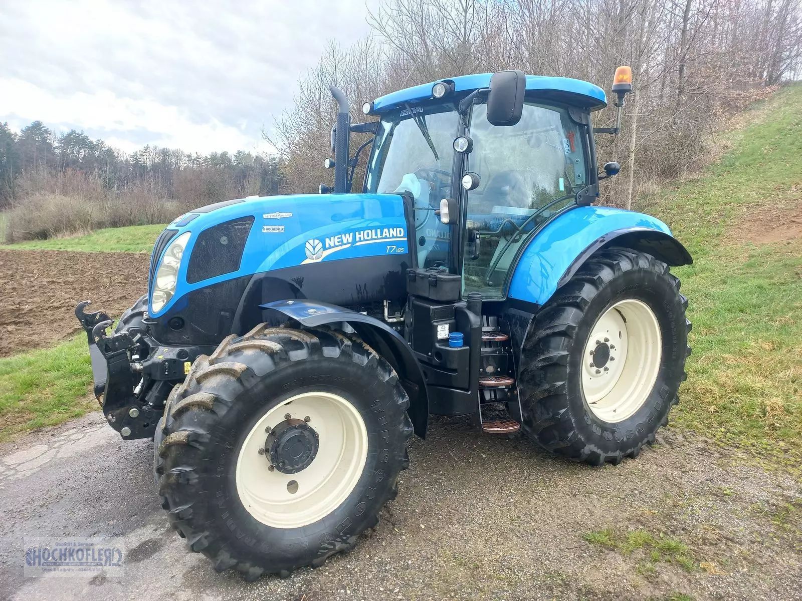 E-FARM: New Holland T7.185 - Τρακτέρ - id 8RNXSQQ - 66.372 € - Χρονία: 2013 - Μετρητής ωρών: 6.695,Ισχύς κινητήρα: 188,Αυστρία