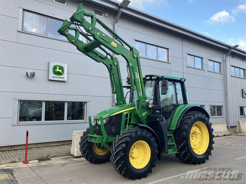 E-FARM: John Deere 6120 M - Trattore - id AJJBPFS - 67.316 € - Anno di costruzione: 2021 - Ore: 2.550,Regno Unito