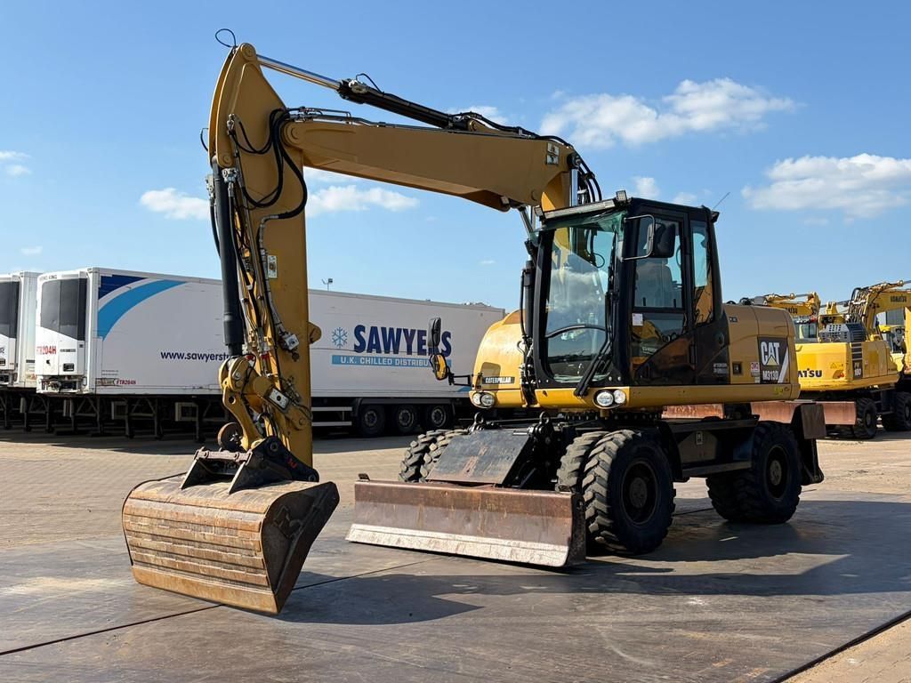 Caterpillar m313d va - outriggers + blade Wheeled excavator €44,750