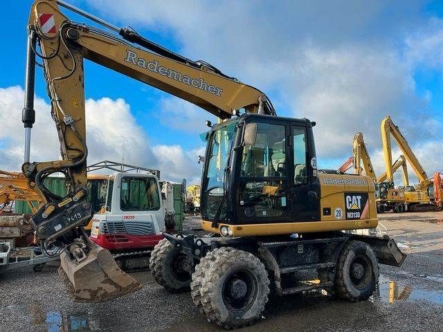 Caterpillar 313 d oilquick 70/55 oil quick Excavadora de ruedas 79.500 €
