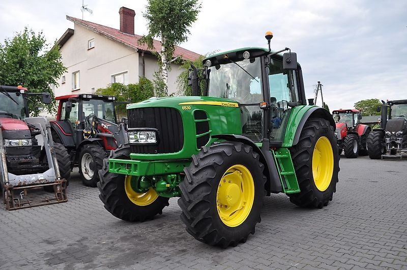 E-FARM: John Deere 6530 - Τρακτέρ - id Y2DWGSZ - 34.312 € - Χρονία: 2009 - Μετρητής ωρών: 7.100,Ισχύς κινητήρα: 120,Πολωνία