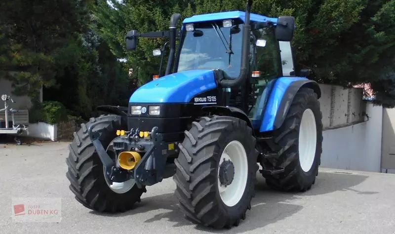 E-FARM: New Holland TS115 - Trattore - id GUQNZXL - 39.583 € - Anno di costruzione: 2001 - Ore: 5.305,Potenza del motore: 115,Austria