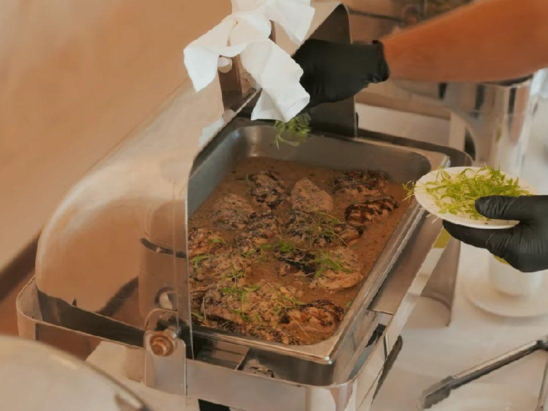 A sit-down lunch being plated at La Casa Del Mar.