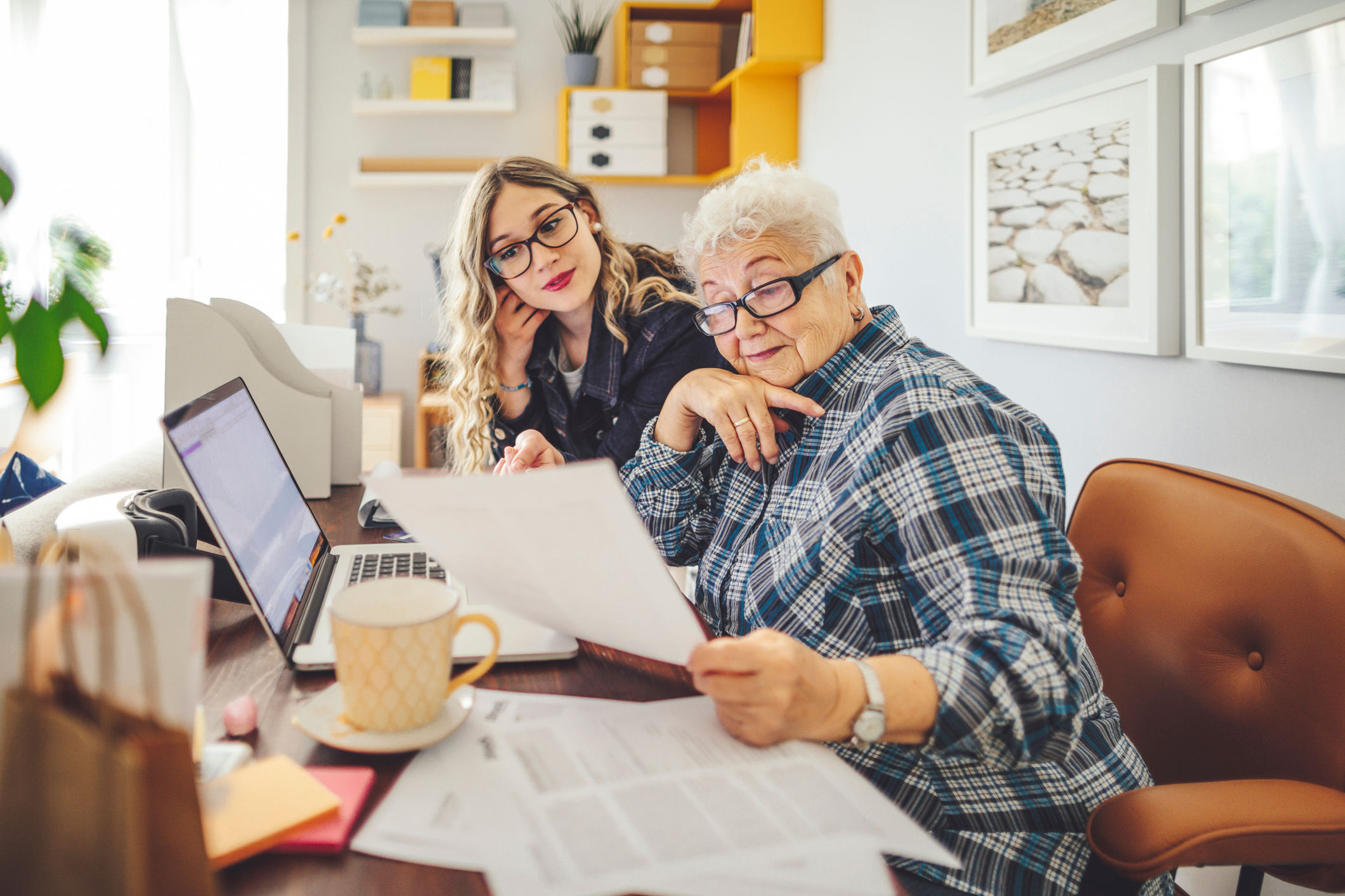 Woman and daughter reviewing power of attorney documents