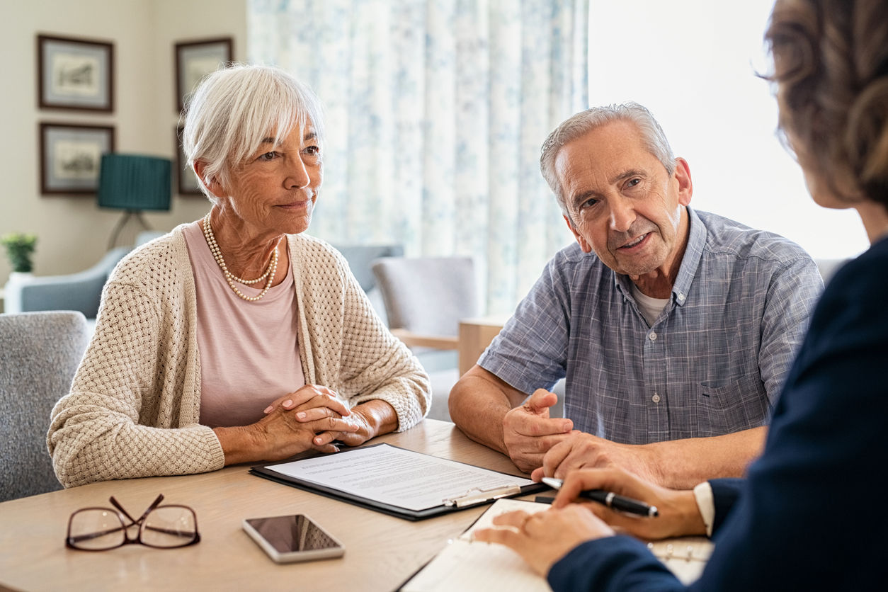 Couple speaking with an estate planning attorney