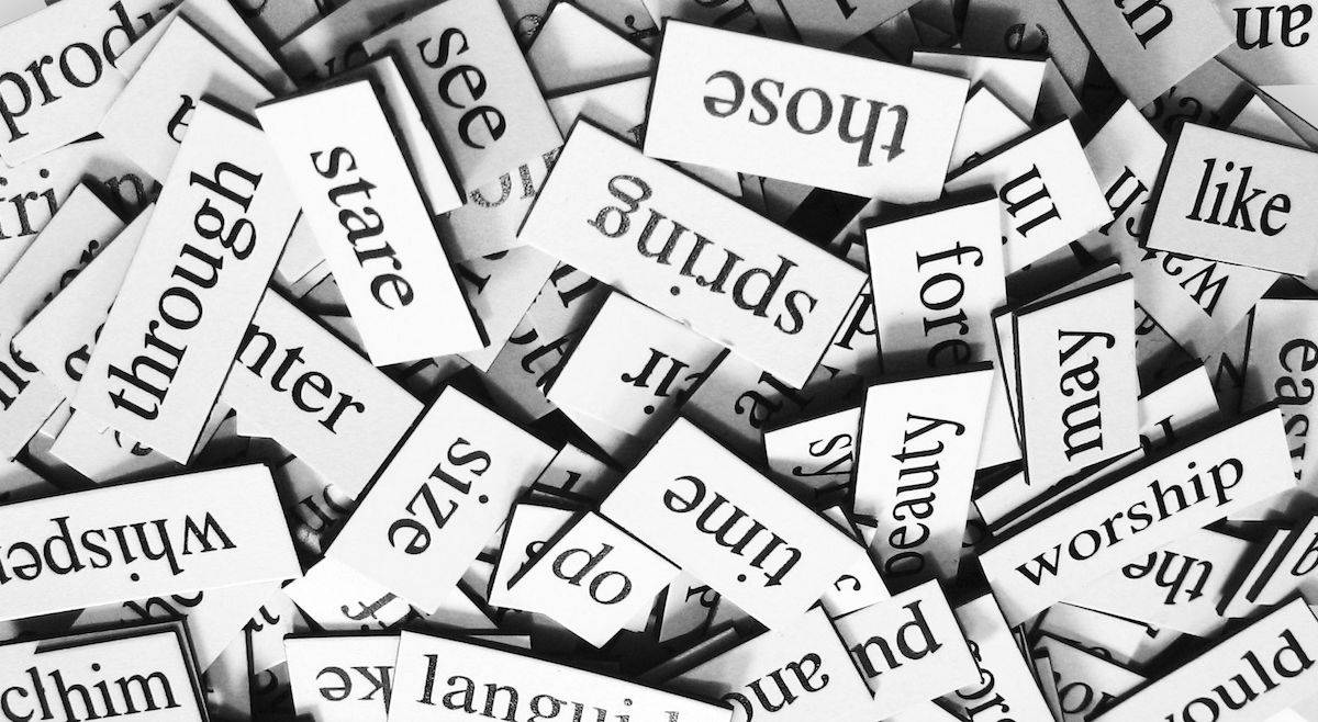 a pile of magnetic poetry magnets