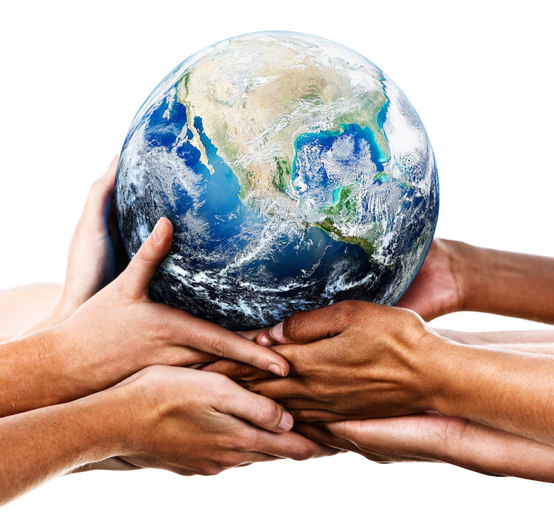 group of hands all holding up an earth globe