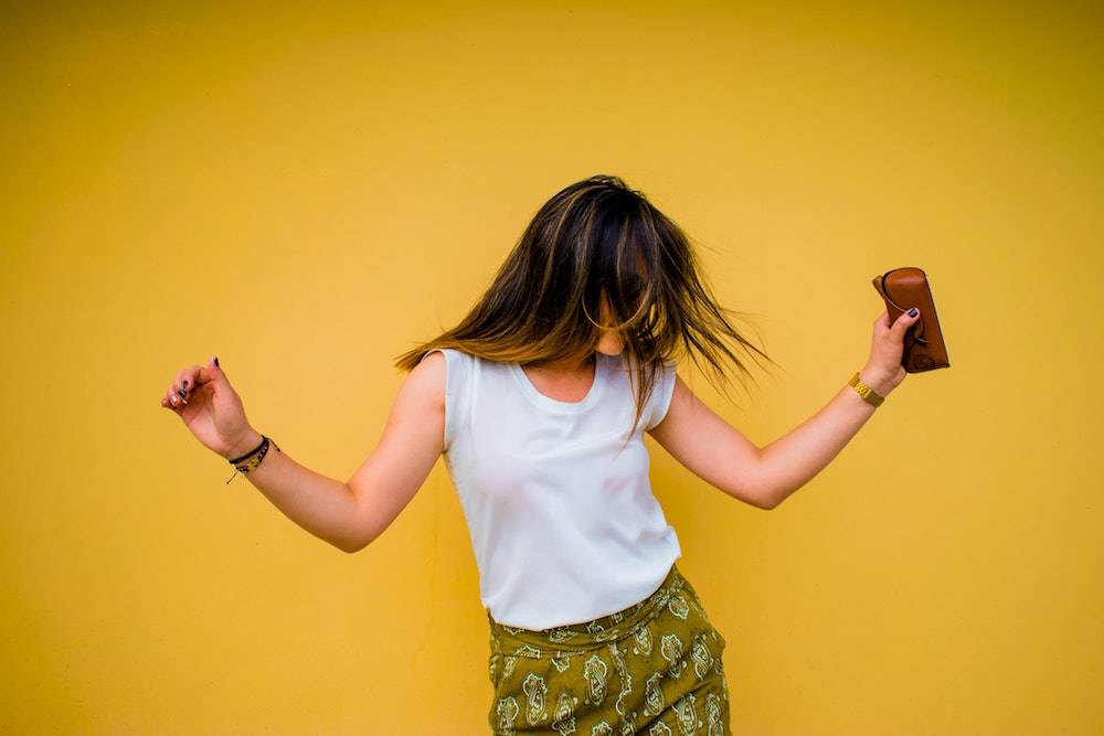 woman dancing joyously