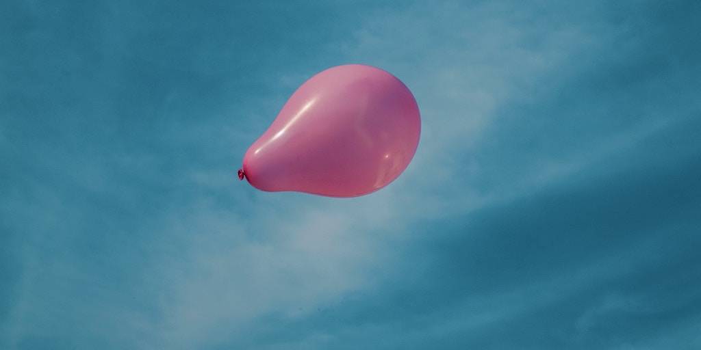 a balloon blowing in the wind - when to bless and release a client