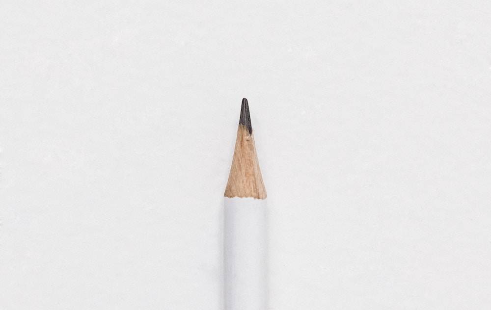 ow to choose word of the year - pencil on a white background