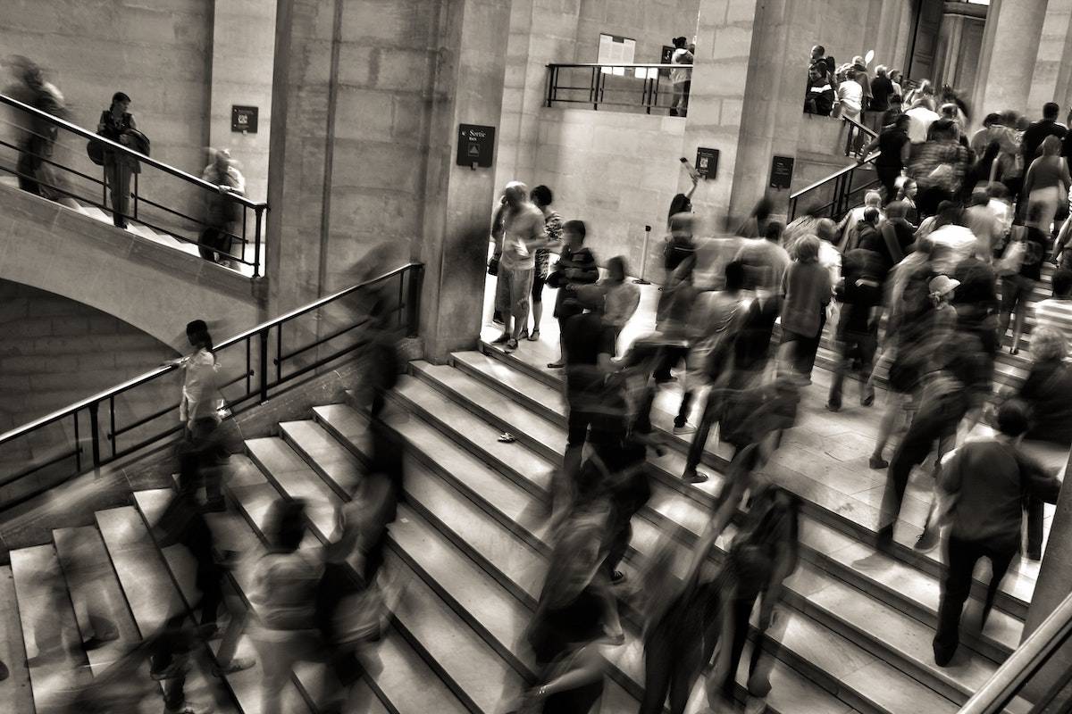 I'm too busy A bustling train station with lots of people