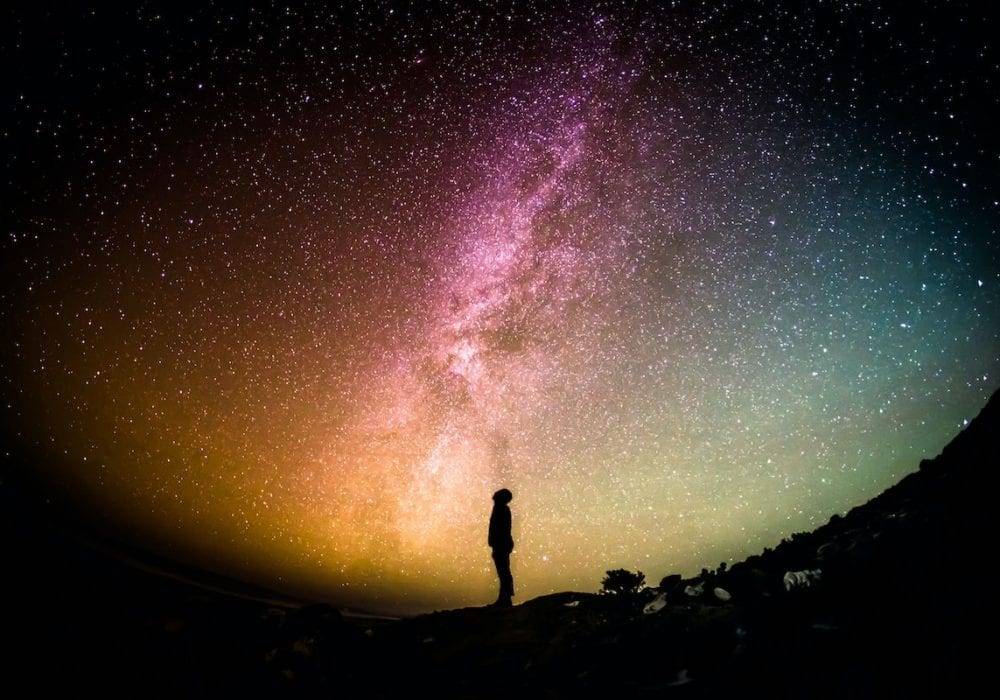 personal mission statement free template person standing on a hillside looking up into a colorful night sky