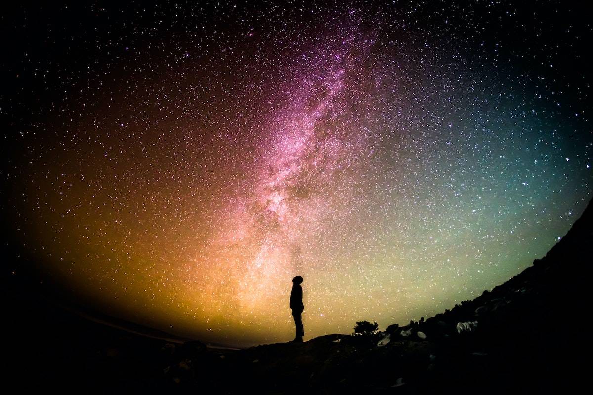 personal mission statement free template person standing on a hillside looking up into a colorful night sky