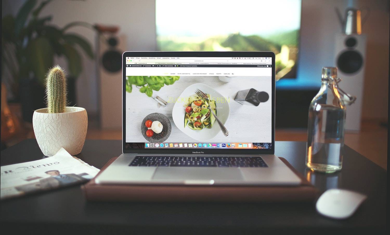 what does above the fold mean? a food website on a laptop sitting atop a stylish table