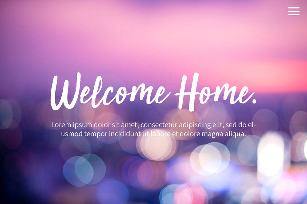 a screenshot of a website that says Welcome Home with a blurred lights photo in the background