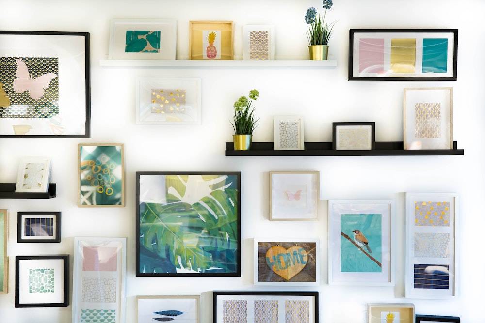 a white wall with lots of shelves and various colorful items