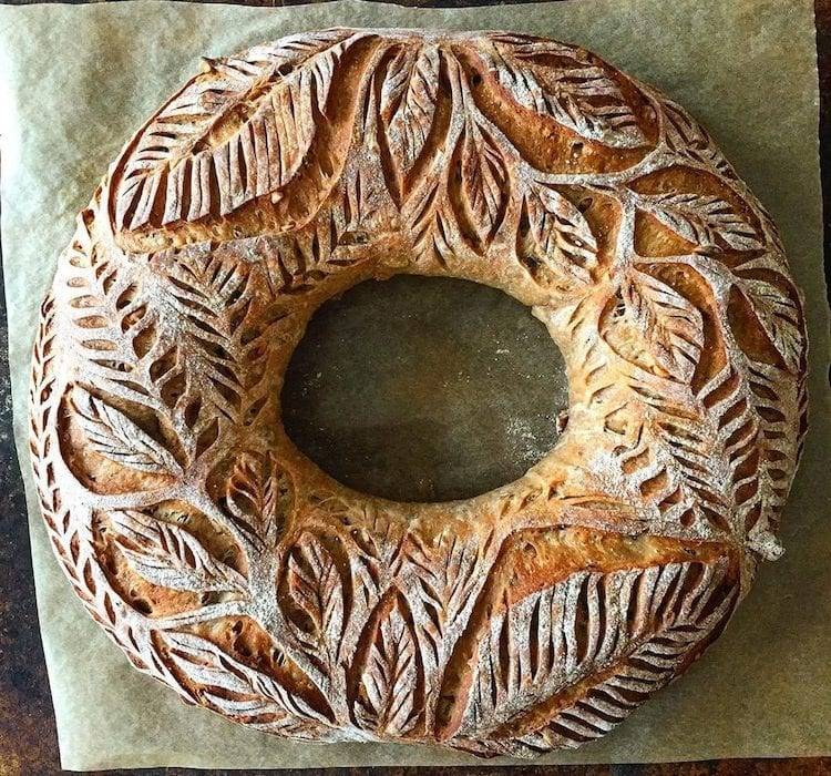 how to stay creative: a round loaf of bread with beautiful ornate carvings in the crust
