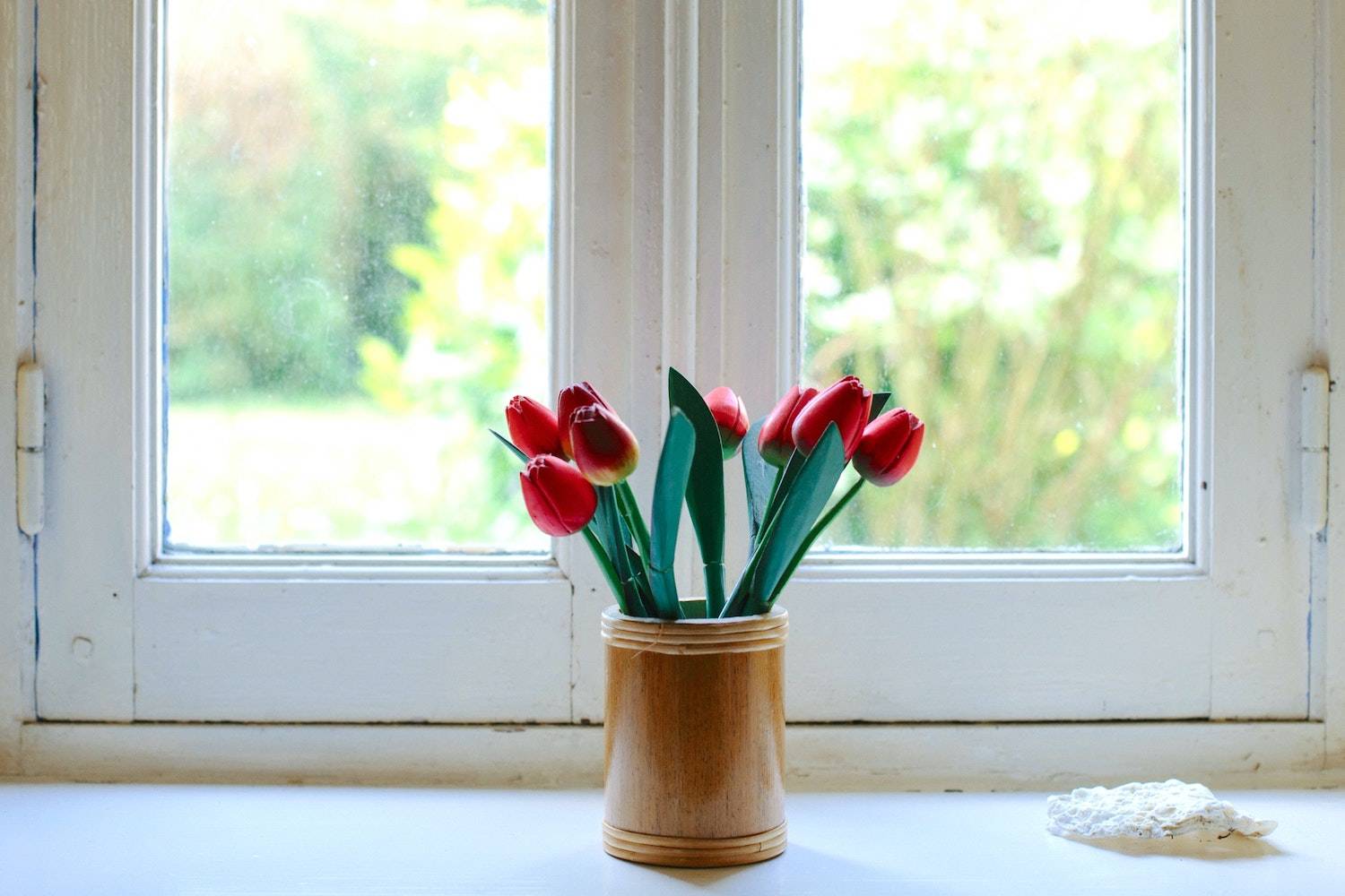 how to stay creative: tulips by a window sill