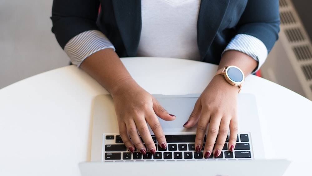 entrepreneurship statistics womans hands on a laptop keyboard