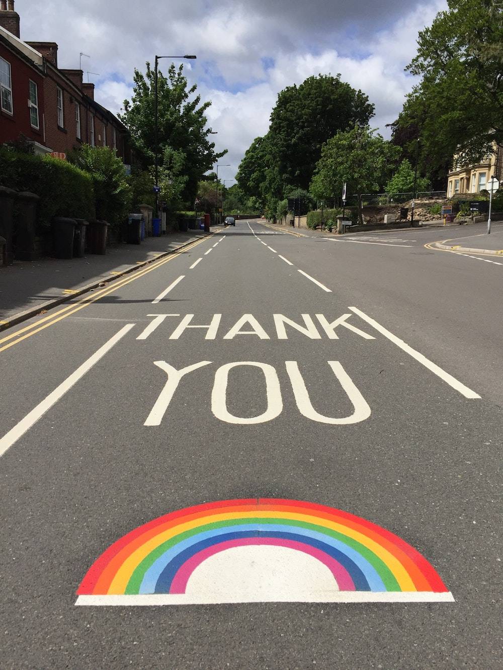 creative ways to say thank you - rainbow painted in the road with thank you in big letters