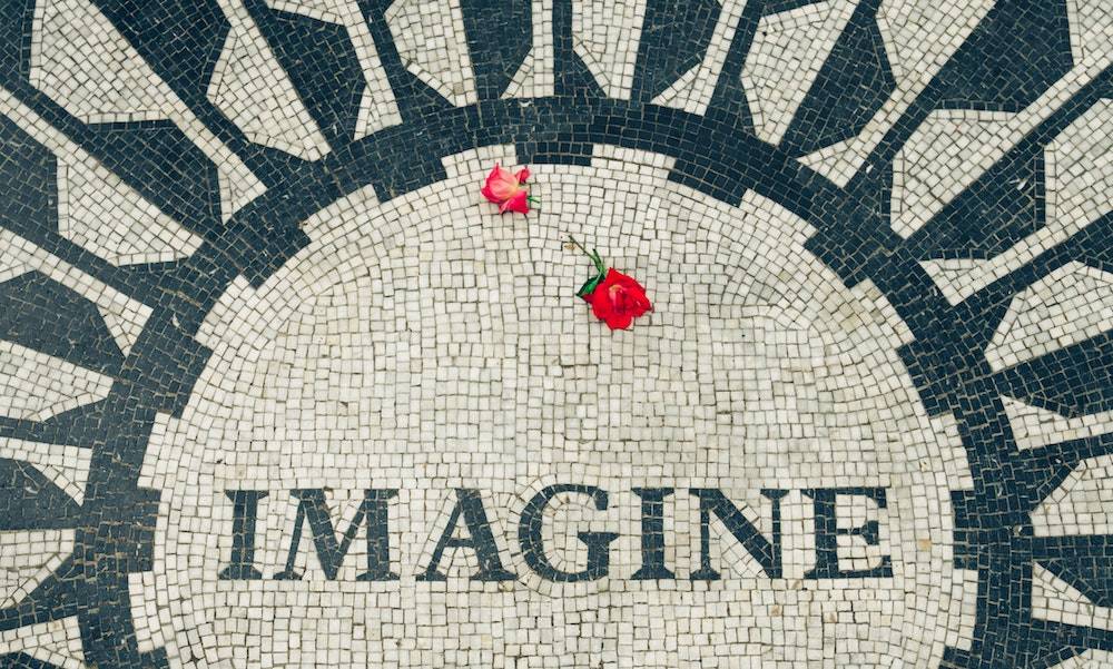 mosaic tiles that says imagine with roses