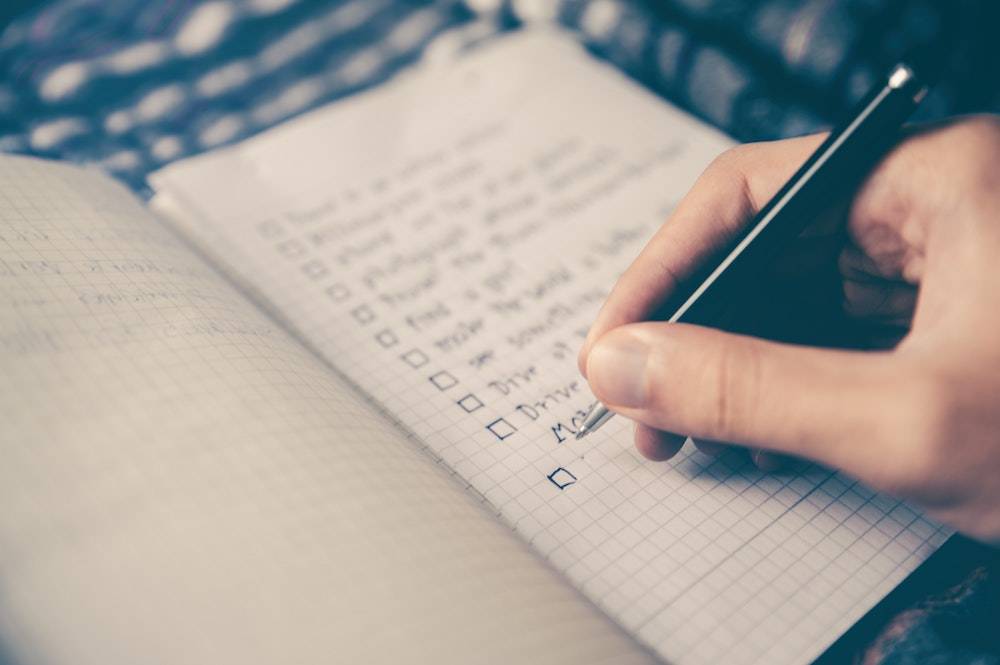 Business weekly to do list - a person making a list