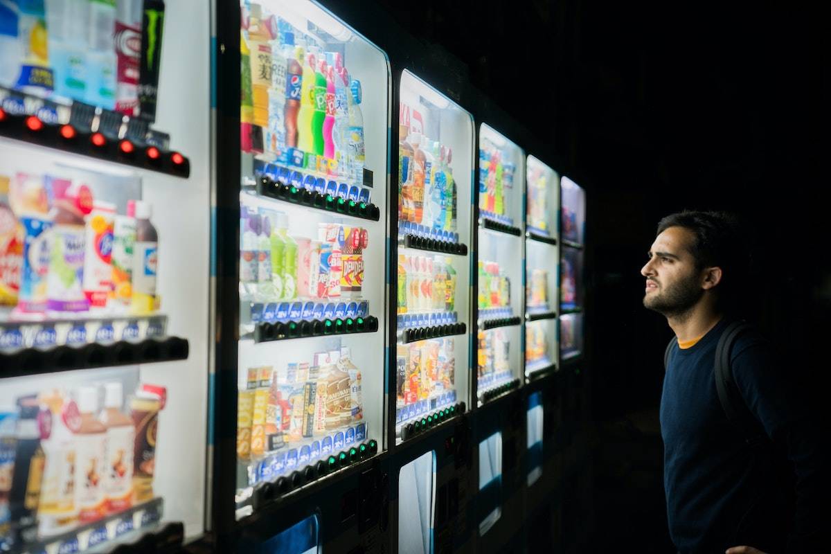 Man looking confused at an infinite array of drink options