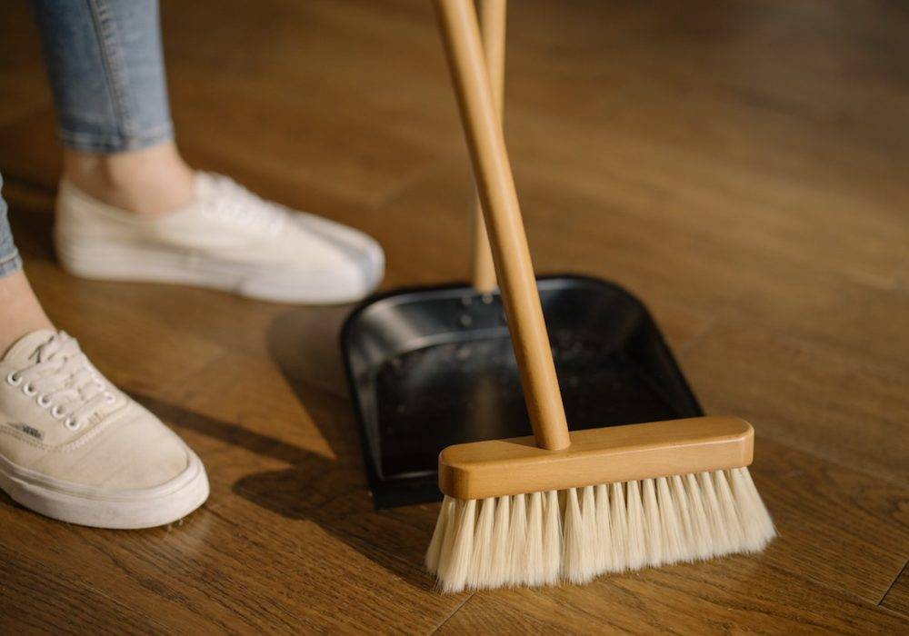 woman with dustpan